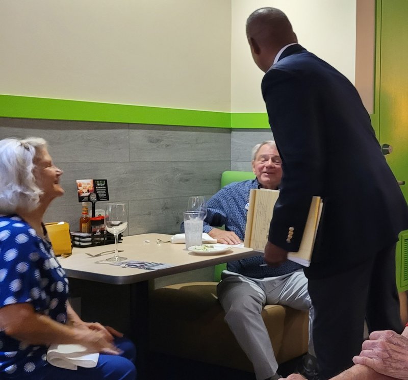 Victor Arias meeting with community members at a local restaurant in Southwest Florida
